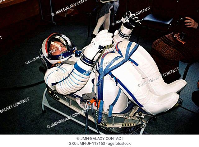 Astronaut Clayton C. Anderson, wearing a Russian Sokol suit, participates in a pressurized test during Sokol suit fit check in a lozheman seat liner in the...