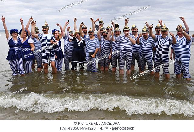 dpatop - 01 May 2018, Mecklenburg-Western Pomerania, Binz: The members of Duesseldorf's Cigar Club also dipped into the waters of the Baltic Sea for the start...