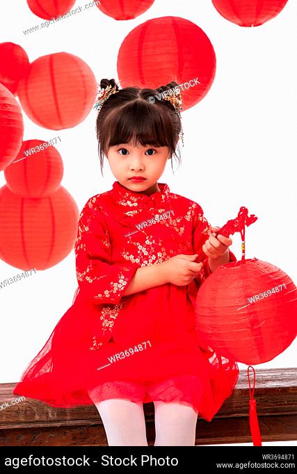 The little girl with a red lanterns to celebrate the New Year
