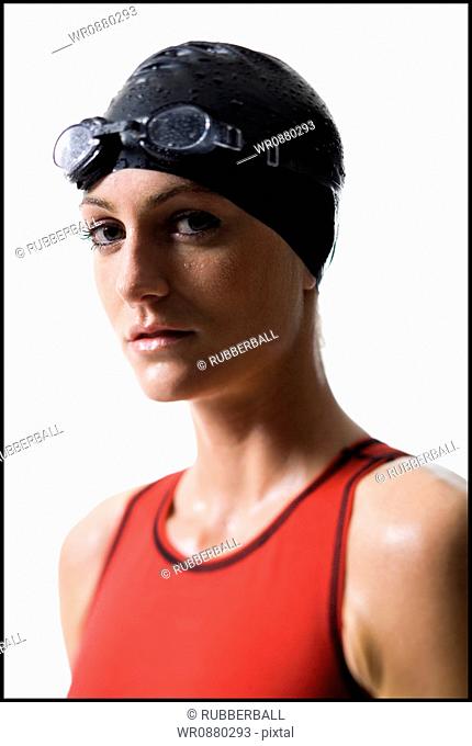 Close-up of a young woman, wearing swimming gear