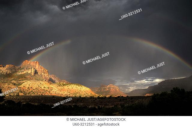 A rainbow appears during a monsoonal thunderstorm at Zion National Park, Utah