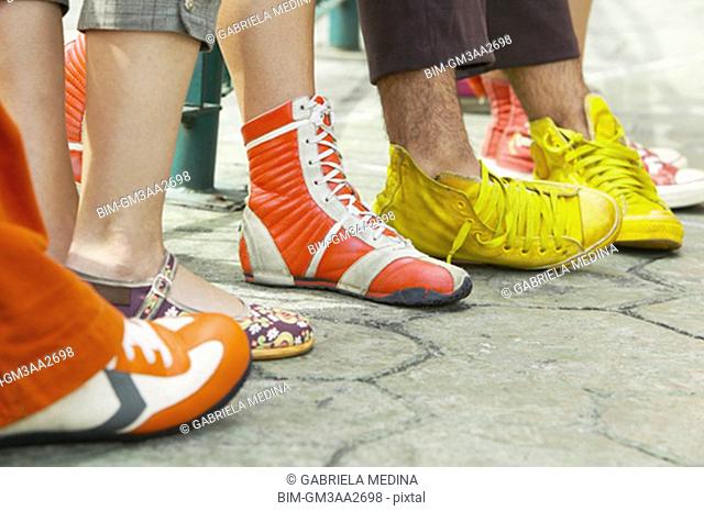 Close up of group of young peopleÆs feet with funky shoes