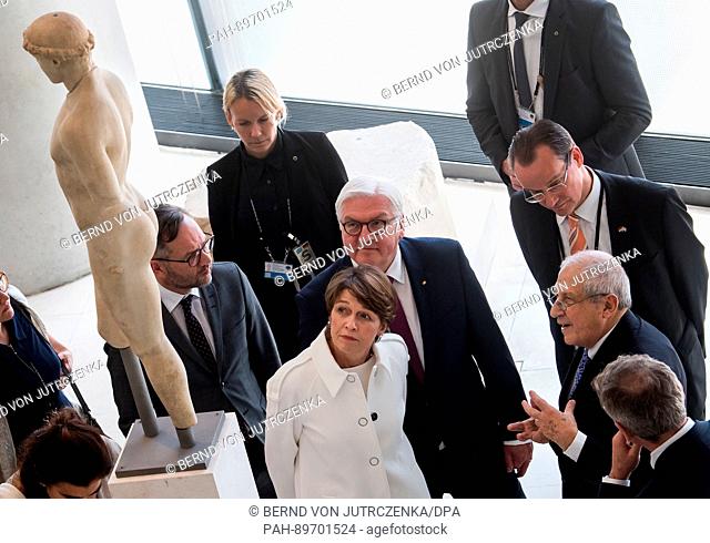 German President Frank-Walter Steinmeier (L) and his wife Elke Buedenbender visit the international art exhibition Documenta 14 at the National Museum of...