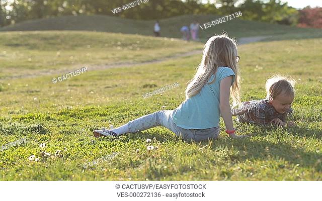 Lovely children enjoying time playing in park