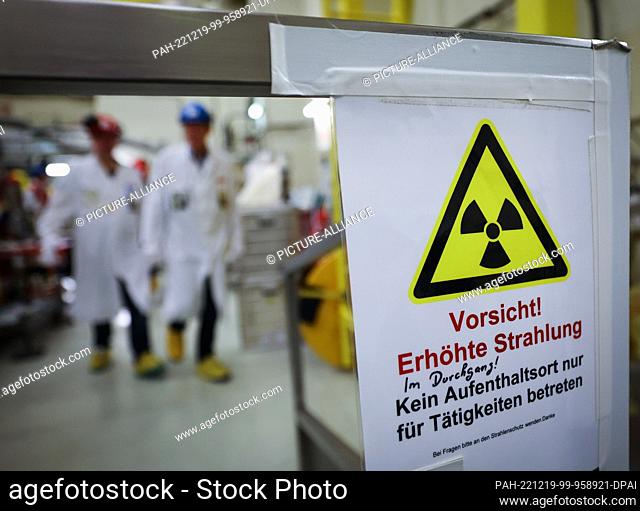 19 December 2022, Schleswig-Holstein, Brunsbüttel: A sign with the inscription ""Caution! Increased radiation"" is stuck to a passageway during a press tour of...