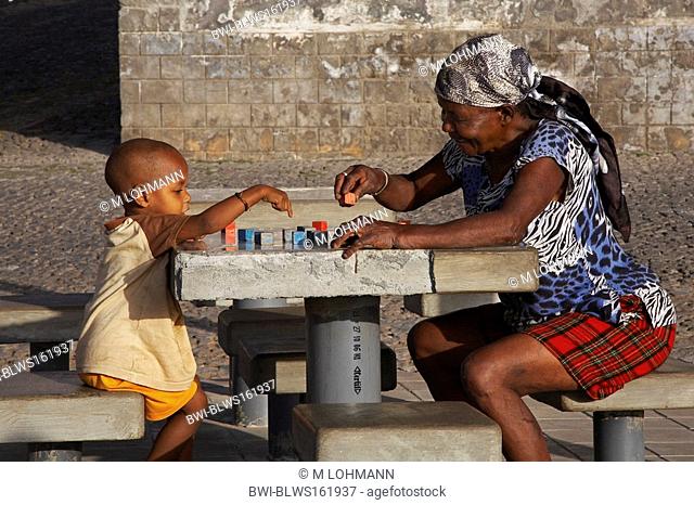 woman and child playing at the harbour, Cap Verde Islands, Cabo Verde, Santo Antao, Ponta Do Sol