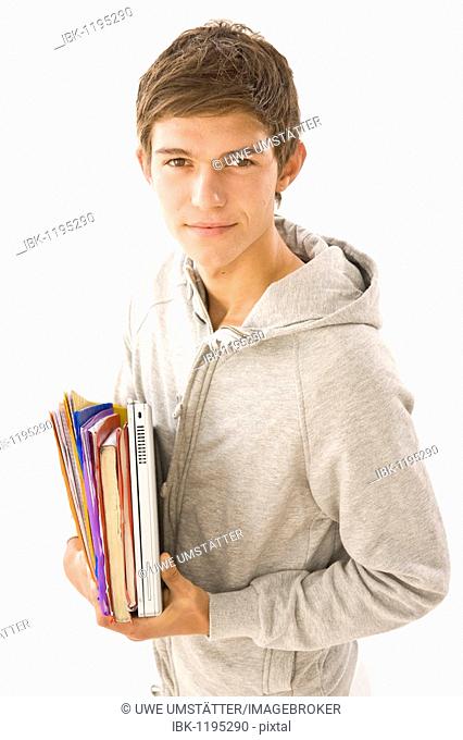 Boy holding exercise books