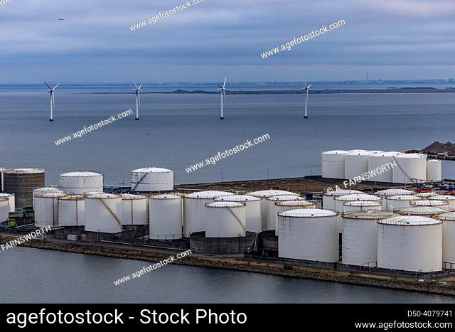 Copenhagen, Denmark Fuel storage tanks and wind turbines off the coastof the city in the port