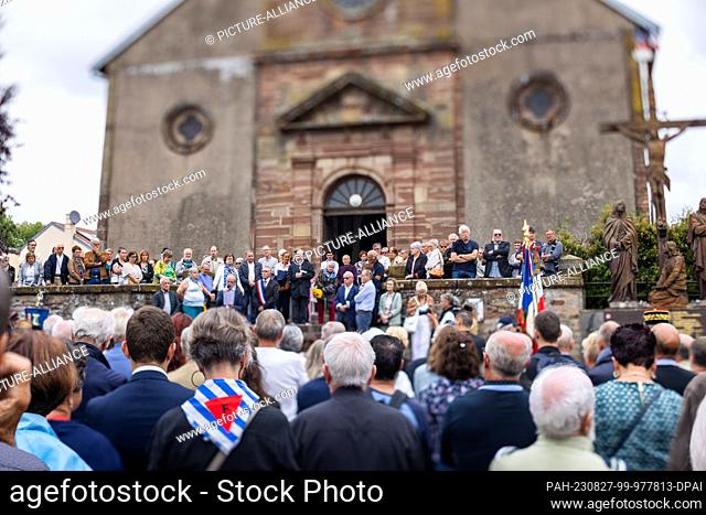 27 August 2023, France, Pexonne: People stand during a memorial service for the victims of the attack on Pexonne on August 27, 1944 in the village church