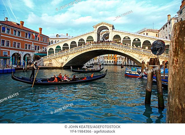 The Rialto Bridge Grand Canal Venice Italy and gondola