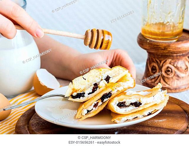thin pancakes stuffed with cheese, prunes and sour cream, add ho