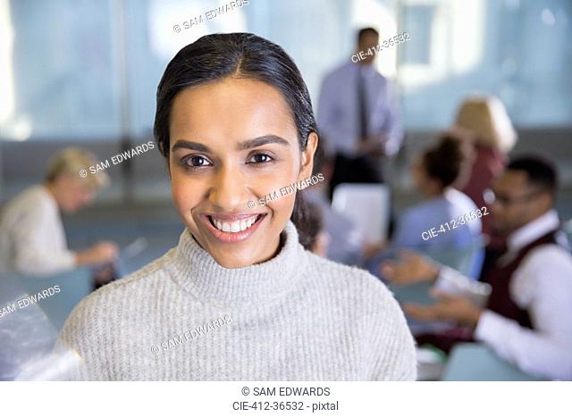 Portrait smiling businesswoman in conference room meeting