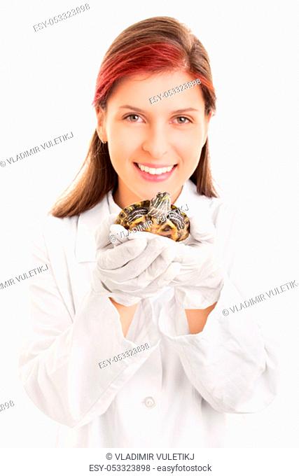 I love animals. Close up shot of a beautiful smiling young veterinarian holding a pet turtle, isolated on white background
