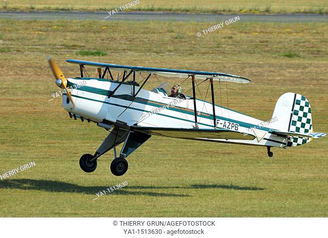 Bücker CASA 1 131 E Jungmann biplane landing on grass airfield, Haguenau, France.These biplane was build in Spain in 1995 on model of the 30's famous german...