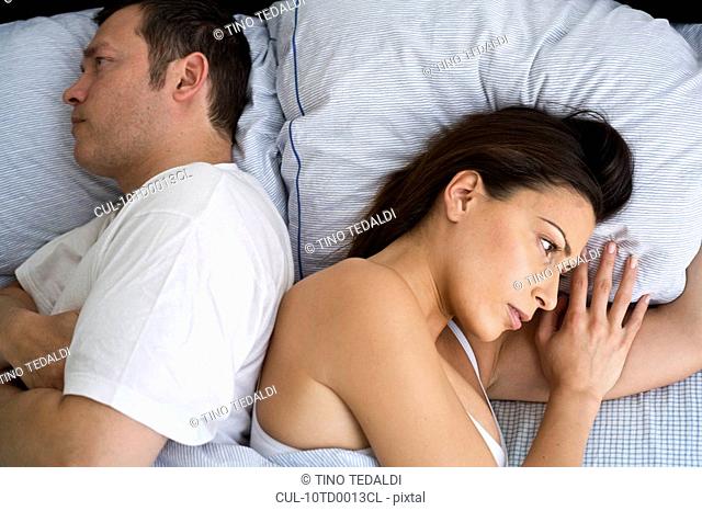Young couple at home in bed