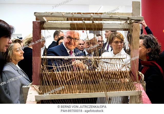 German President Frank-Walter Steinmeier (C-L) and his wife Elke Buedenbender (front 2-R) visit the international art exhibition Documenta 14 at the National...