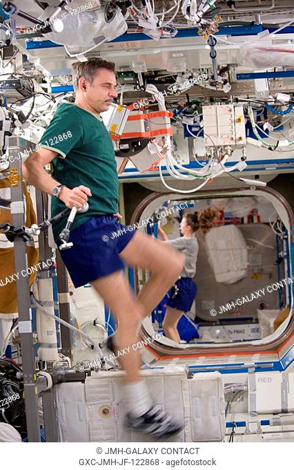 Russian cosmonaut Mikhail Kornienko, Expedition 23 flight engineer, exercises on the Cycle Ergometer with Vibration Isolation System (CEVIS) in the Destiny...