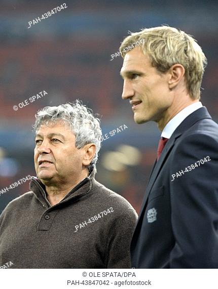 Donetsk's head coach Mircea Lucescu (L) and Bayer Leverkusen's head coach Sami Hyypia before the UEFA Champions League Group A soccer match between Shakhtar...