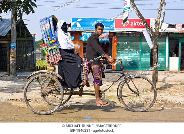 Rickshaw with driver and passenger, Bangladesh, Asia