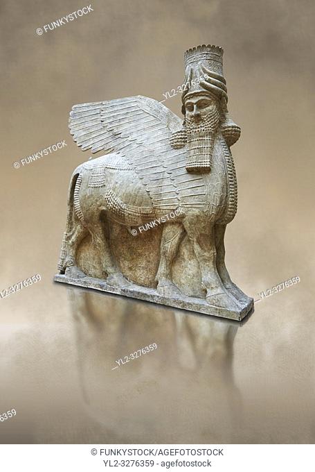 Stone statue of a winged bull. Reproduction from the facade of the throne room, Inv AO 30043 from Dur Sharrukin the palace of Assyrian king Sargon II at...