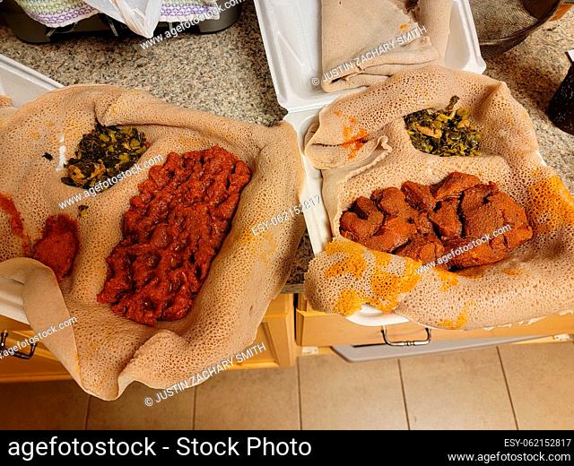 Ethiopian food gored gored and kitfo raw beef with injera bread