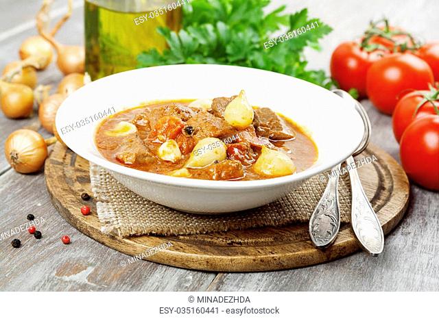 Stifado. Stewed beef with onions and tomatoes