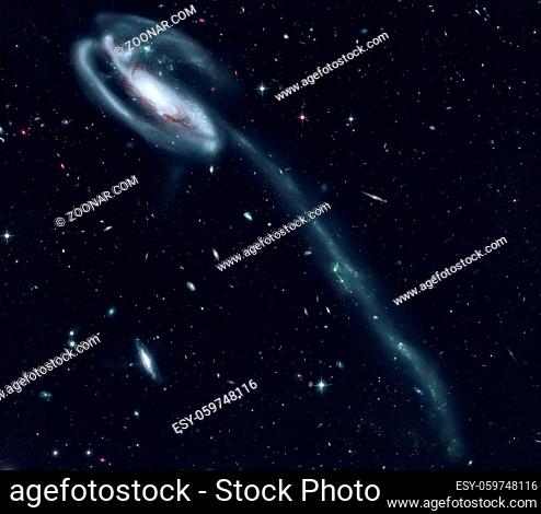 The Tadpole Galaxy is a disrupted barred spiral galaxy in the northern constellation Draco. Retouched image. Elements of this image furnished by NASA