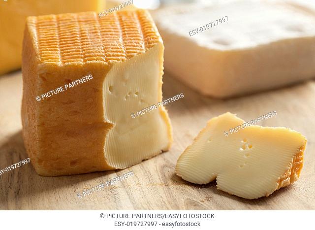 Piece of Belgian Limburger cheese on a cheese board
