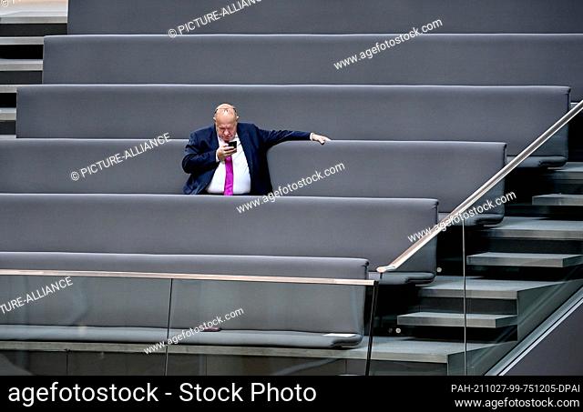 26 October 2021, Berlin: Federal Minister of Economics Peter Altmaier (CDU) sits in the gallery during the constituent session of the new Bundestag