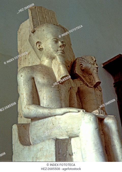Amon seated next to Tutankhamun, statue made in calcite, 1350 BC