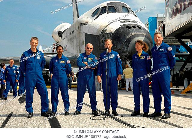 The STS-121 crew addresses greeters in front of the Space Shuttle Discovery near the landing facility at Kennedy Space Center following NASA's second Return to...