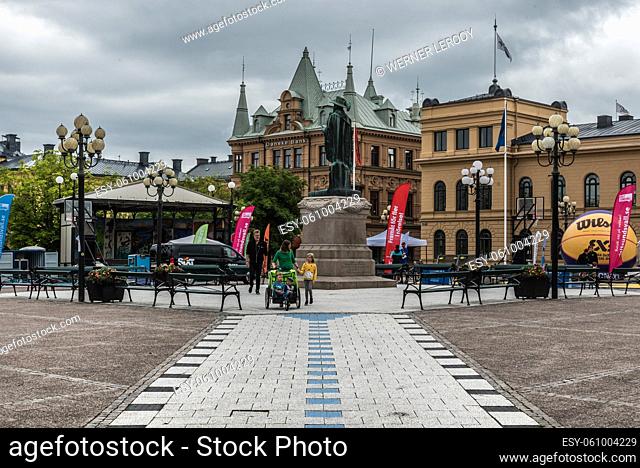 Sundsvall, Vastnorrland County - 08 02 2019: Tourists and locals walking over the main city square with the town hall