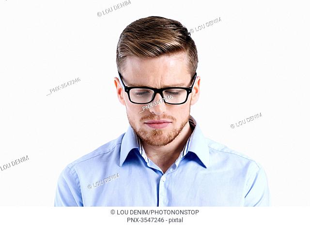man in a blue shirt, glasses, beard, white background