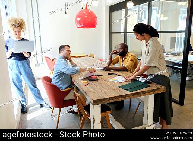 Business people working together in modern coworking space