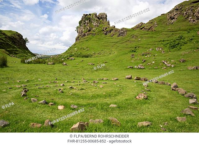 View of stone circle and rock outcrop 'tower' formation, Castle Ewen, Fairy Glen, Trotternish Peninsula, Isle of Skye, Inner Hebrides, Scotland, July