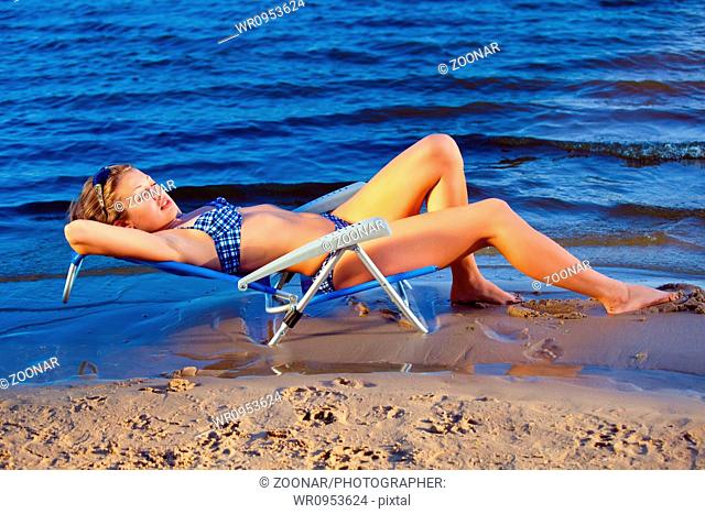 girl lying on a beach