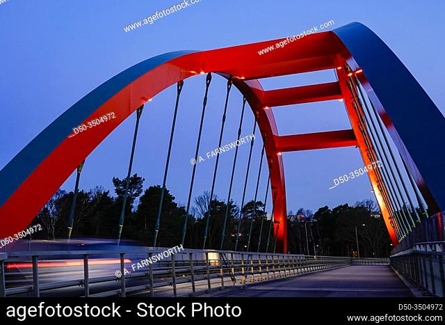 Stockholm, Sweden, A red pedestrian and bicycle bridge the suburb of Vastberga