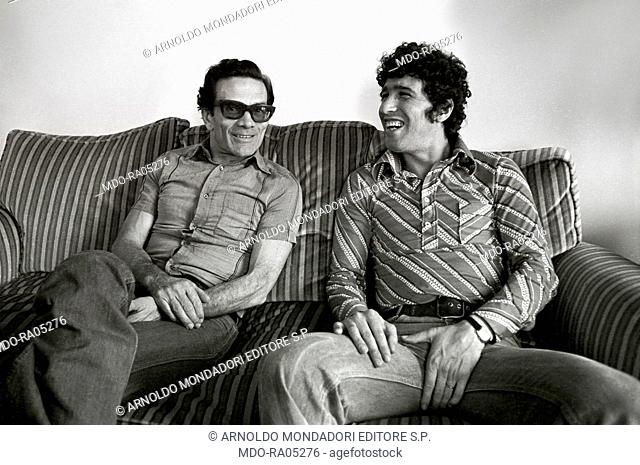Italian director and writer Pier Paolo Pasolini posing with Italian actor Ninetto Davoli (Giovanni Davoli). Cannes, 1970