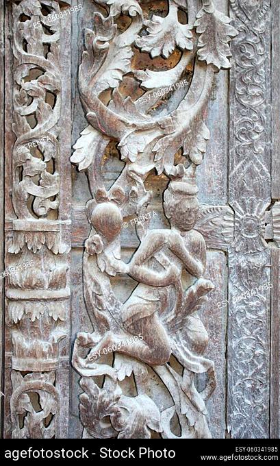 Detail of ancient wooden carved wall ornament in Shwenandaw monastery (Golden Palace Monastery), Mandalay region, Myanmar, Indochina
