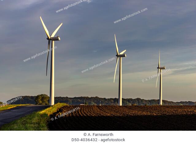 Keldby, Denmark Three wind turbines in an early mornng farming landscape
