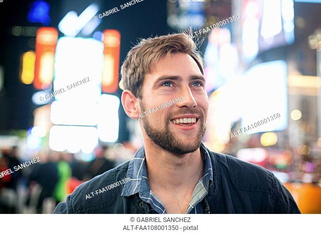 Young man amazed by his surroundings, Times Square, New York City, New York, USA