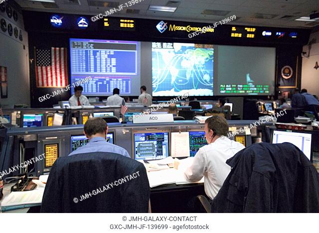 An overall view of activity in the Shuttle (White) Flight Control Room as flight controllers participate in a long-duration simulation for the STS-114 mission