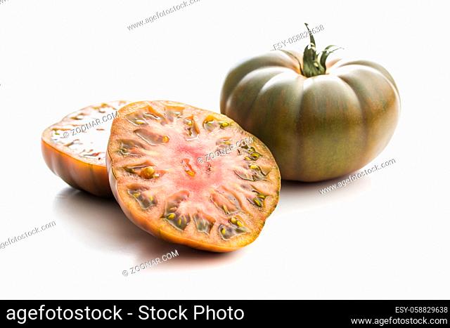Dark brandywine tomatoes isolated on white background