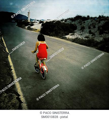 Girl learning has cycling on the beach of Benicassim, Castellon, Valencia, Spain