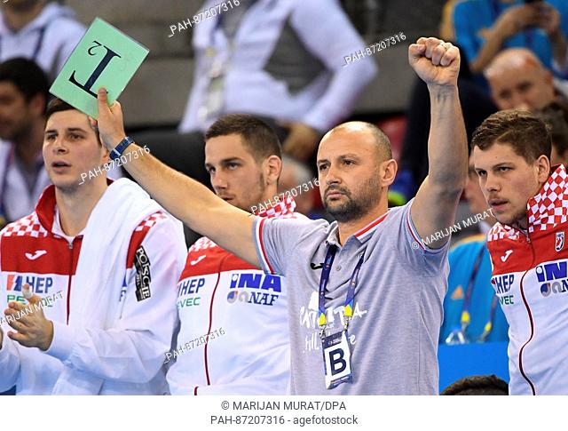 Croatia's headcoach Zeljko Babic raises his arms during the Handball worldcup match between Croatia and Saudi Arabia at the Kindarena in Rouen, France