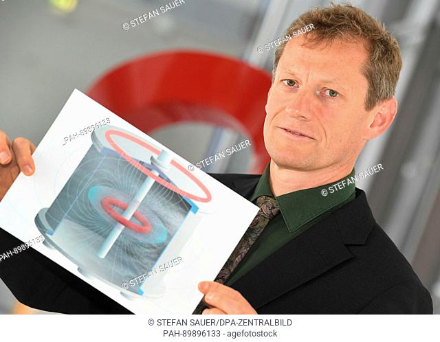 The plasma physicist of the Max Planck Institute for Plasma Physics, Thomas Sunn Pedersen, shows a design of the Electron-Positron plasma trap APEX-D in...