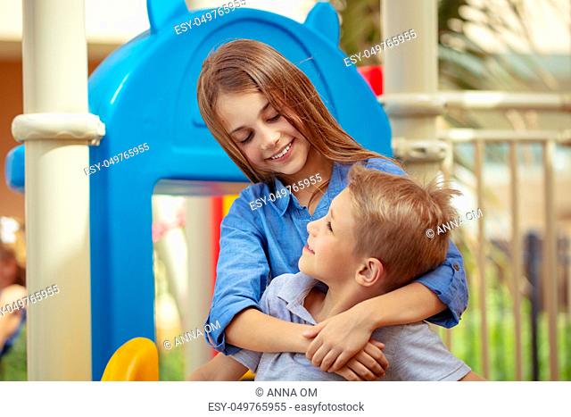 Closeup portrait of a cute siblings looking on each other with love, active summer holidays, brother and sister enjoying spending time together