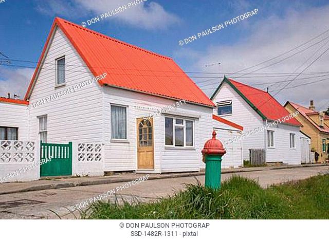 Fire hydrant in front of a house, Stanley, Falkland Islands, England