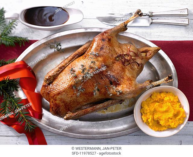 Roast Christmas goose with mashed potatoes and pumpkin