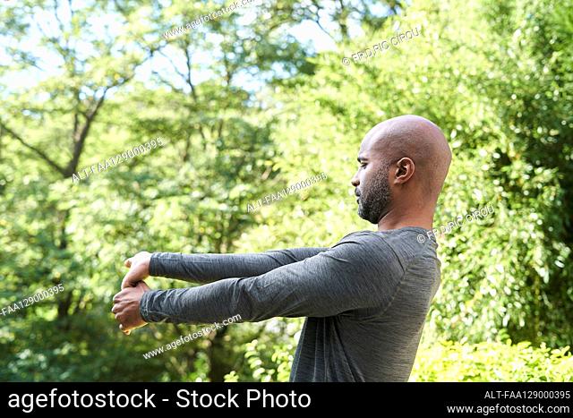 Man doing exercise in garden
